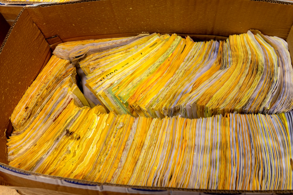 Box,Of,Yellow,And,White,Water,Damaged,Papers,,Soaked,In water damaged documents and files