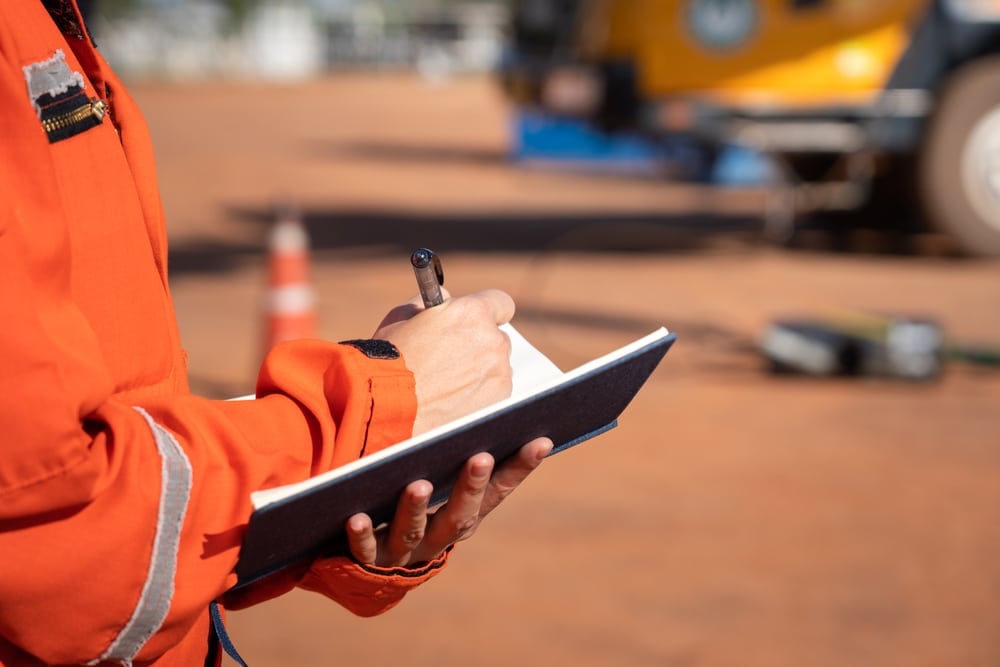 Action,Of,Safety,Officer,Is,Taking,Note,On,Checklist,With Business equipment restoration