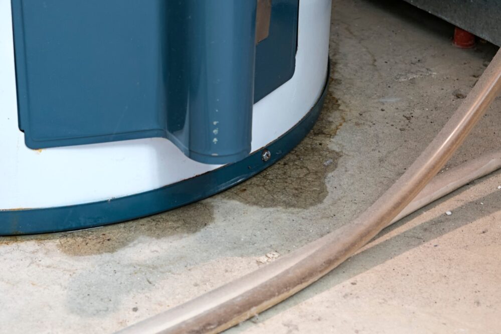 Water,Underneath,A,Water,Heater,Shows,The,Beginning,Of,A Why is my water heater leaking and what should i do